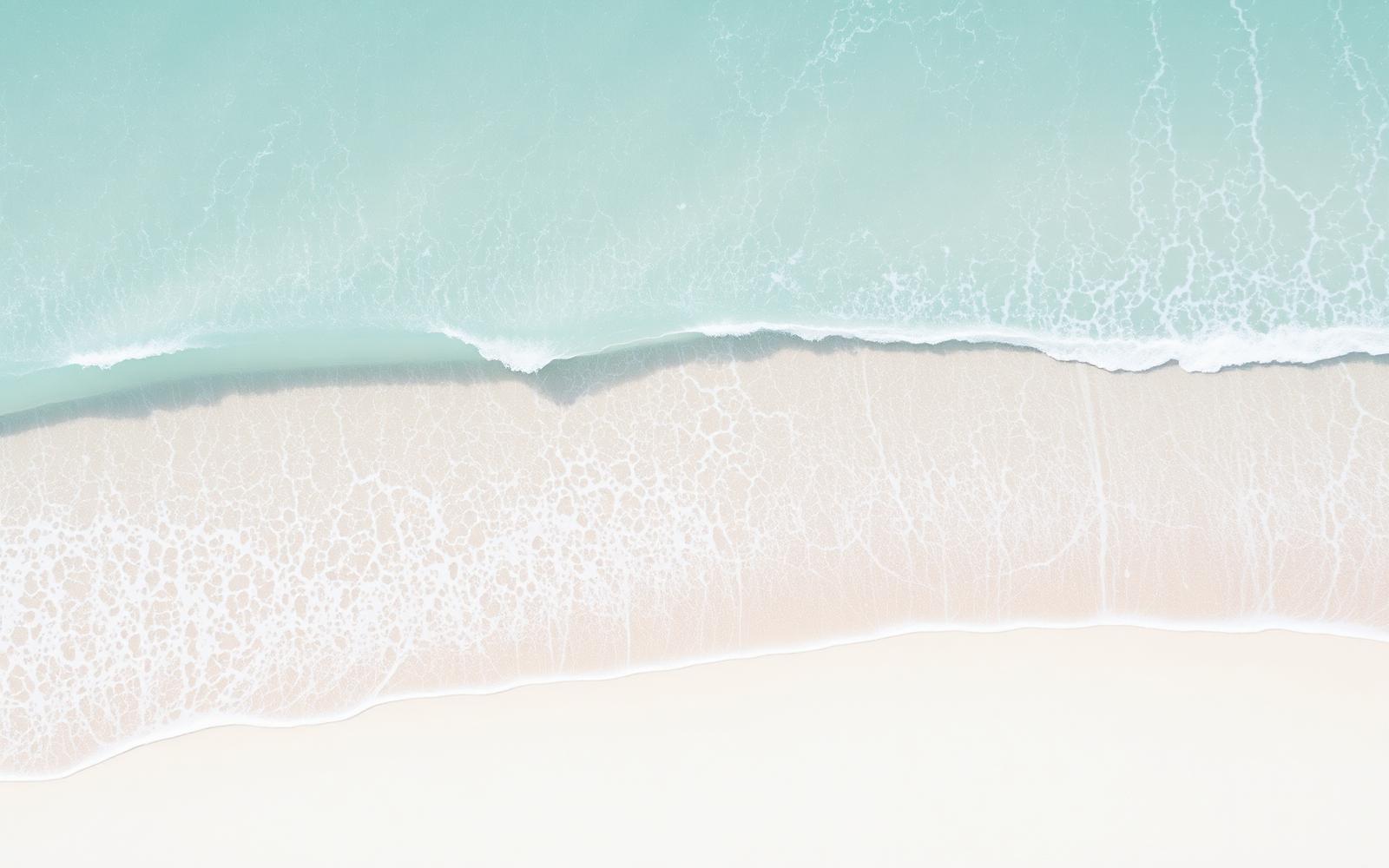 Aerial view of soft waves on a sand beach